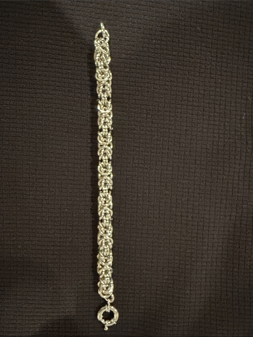 Chunky silver toned bracelet.